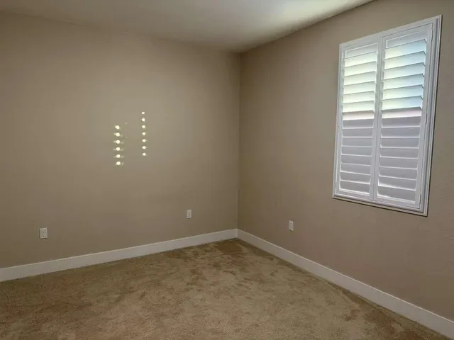 a hallway with wooden floor