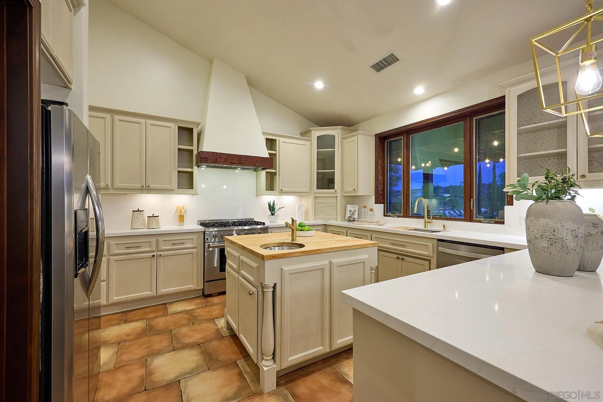 38408 Mesa Road Temecula, CA 92592 - Photo 11 of 57 a kitchen with a sink stove and refrigerator