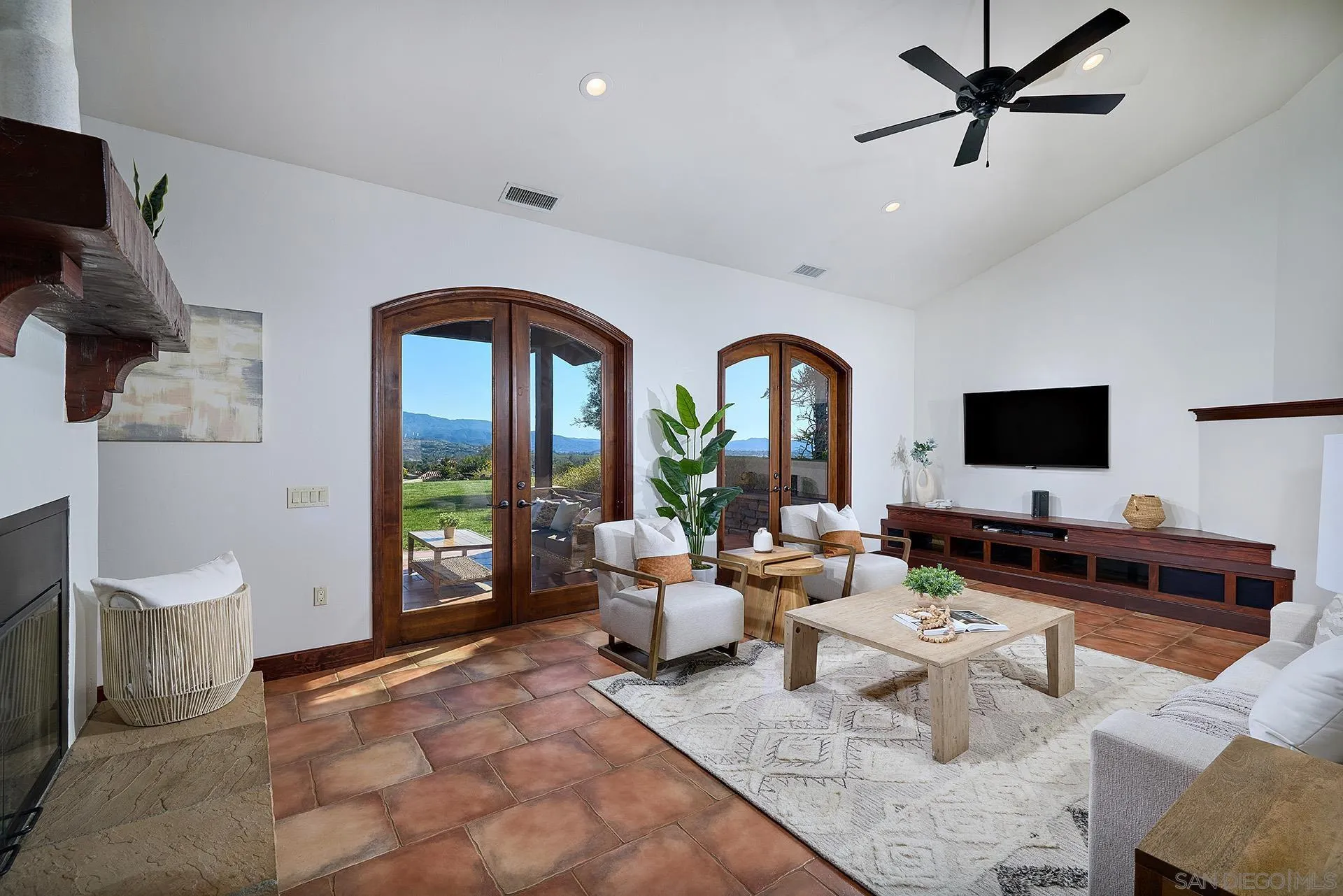38408 Mesa Road Temecula, CA 92592 - Photo 14 of 57 a living room with furniture a flat screen tv and a floor to ceiling window