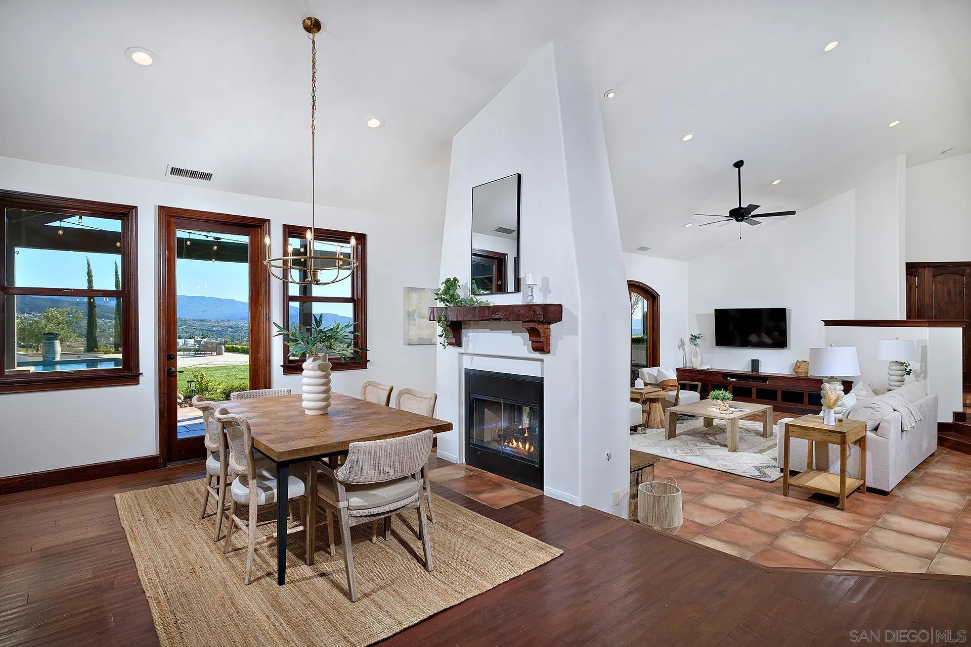 38408 Mesa Road Temecula, CA 92592 - Photo 15 of 57 a living room with furniture a fireplace and a flat screen tv