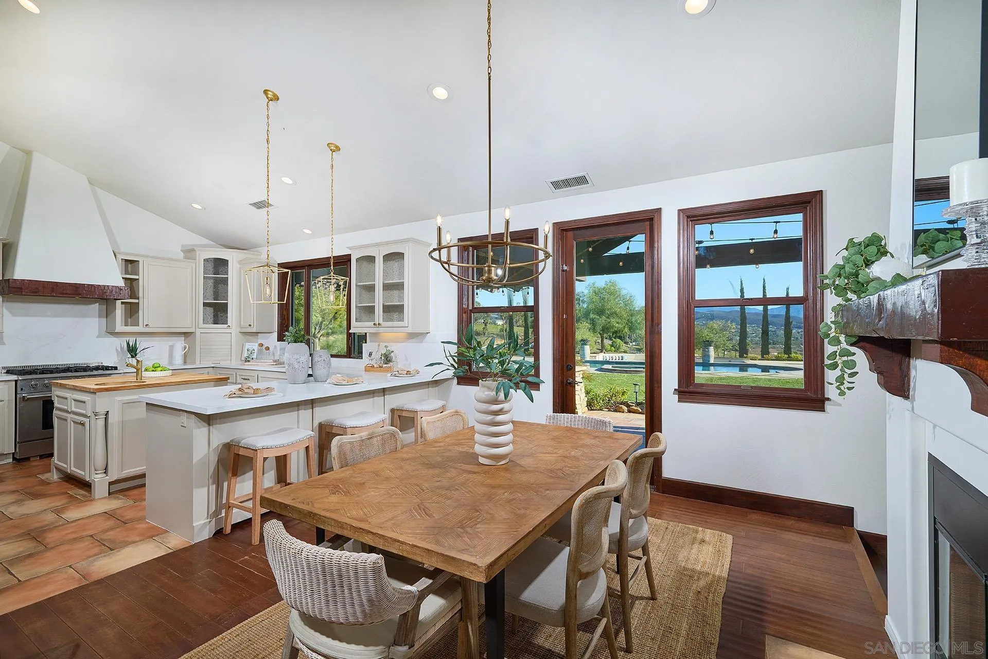 38408 Mesa Road Temecula, CA 92592 - Photo 17 of 57 a kitchen with a table chairs and wooden floor