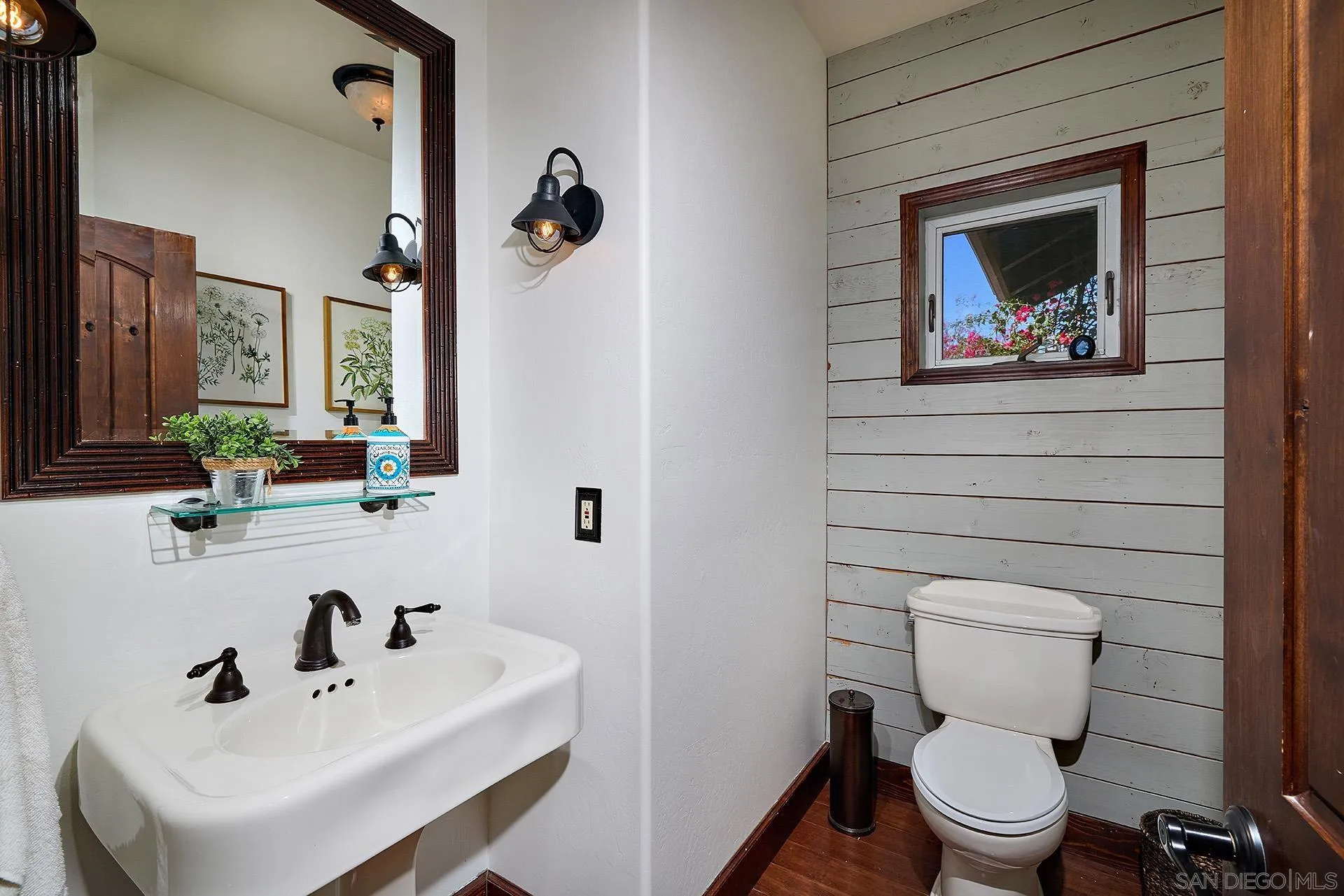 38408 Mesa Road Temecula, CA 92592 - Photo 20 of 57 a bathroom with a toilet a sink and mirror