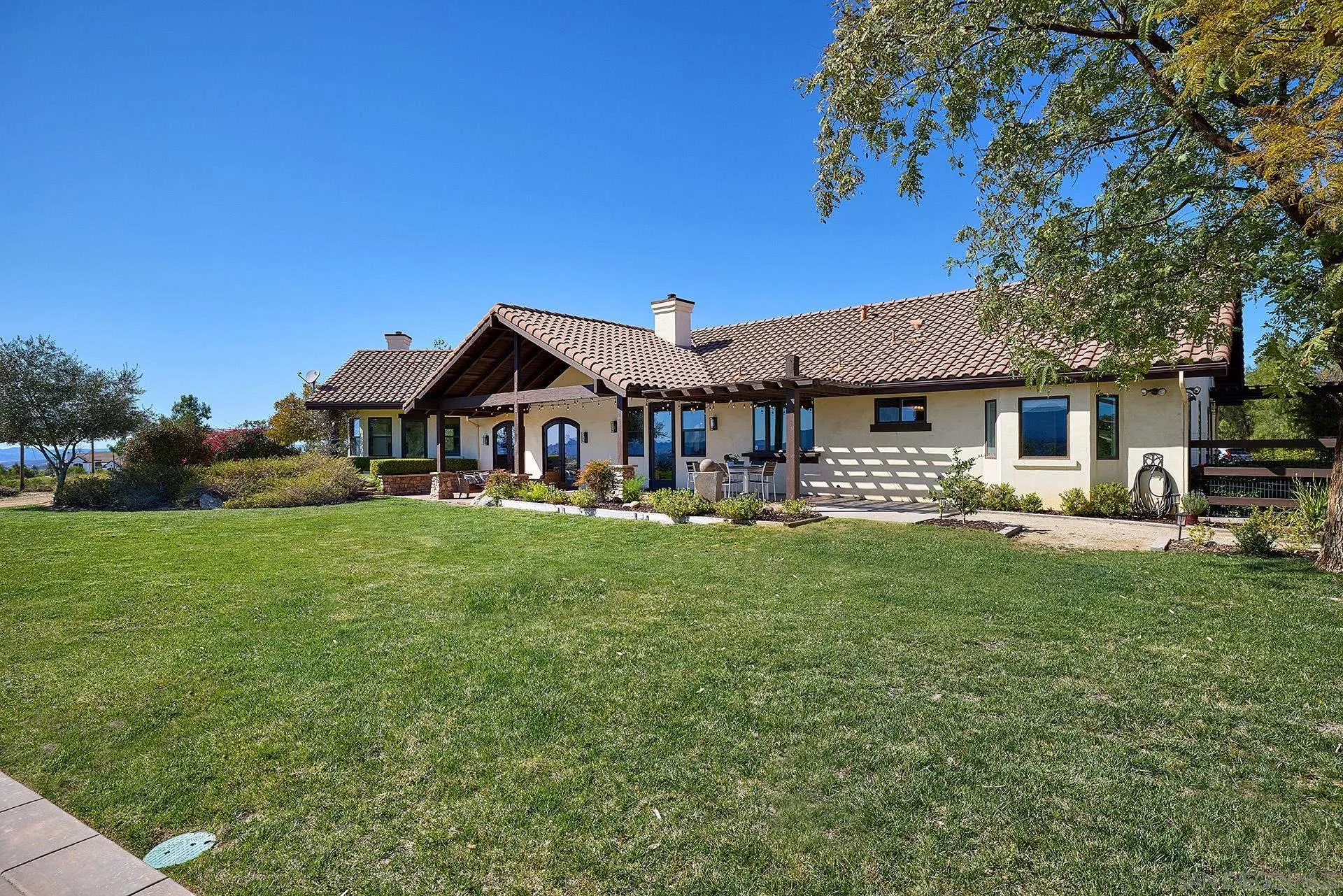 38408 Mesa Road Temecula, CA 92592 - Photo 42 of 57 a front view of a house with garden