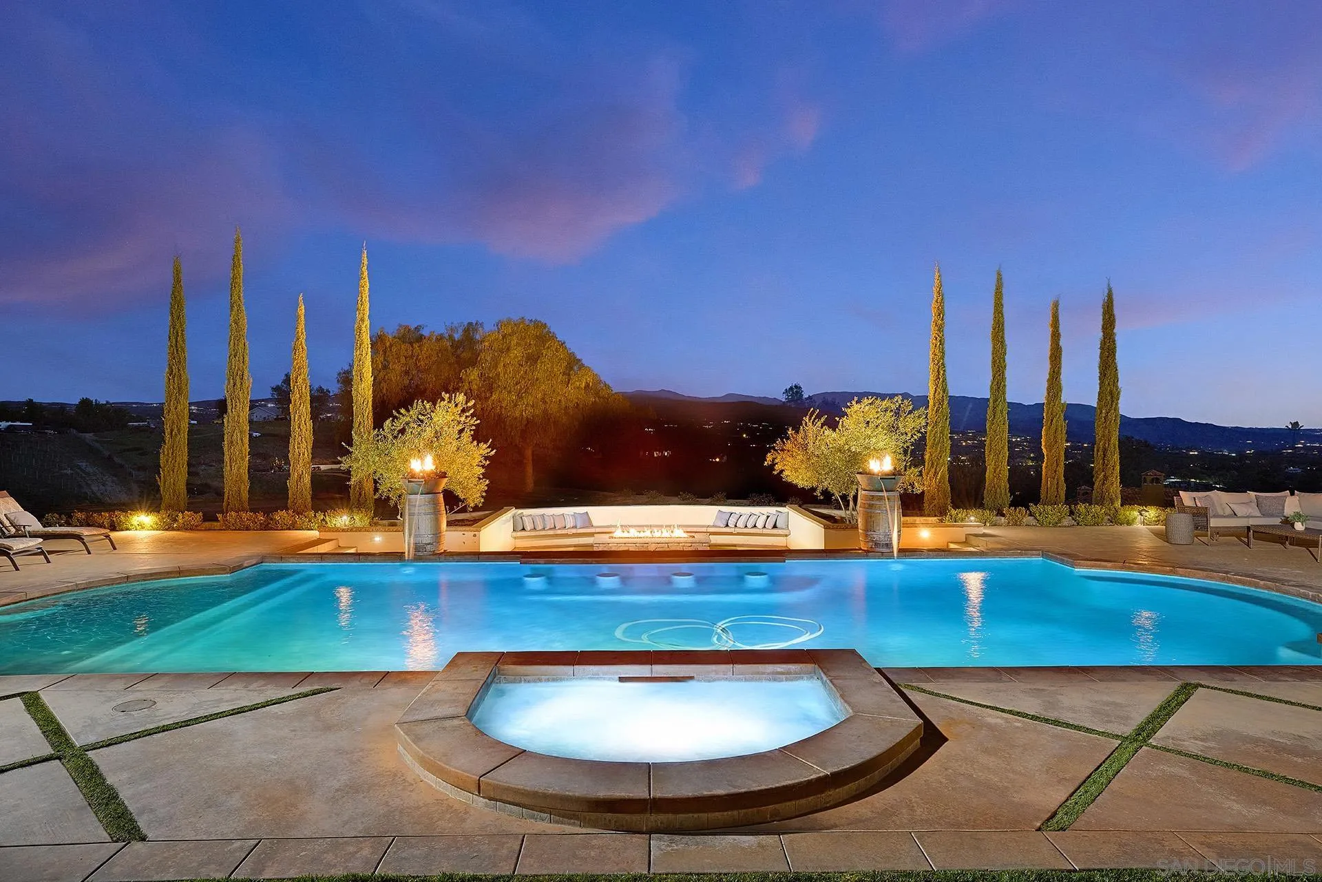 38408 Mesa Road Temecula, CA 92592 - Photo 5 of 57 a view of a swimming pool with a table and chairs