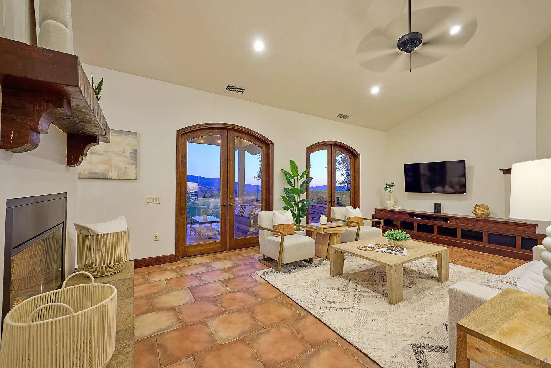 38408 Mesa Road Temecula, CA 92592 - Photo 9 of 57 a living room with furniture a flat screen tv and a floor to ceiling window