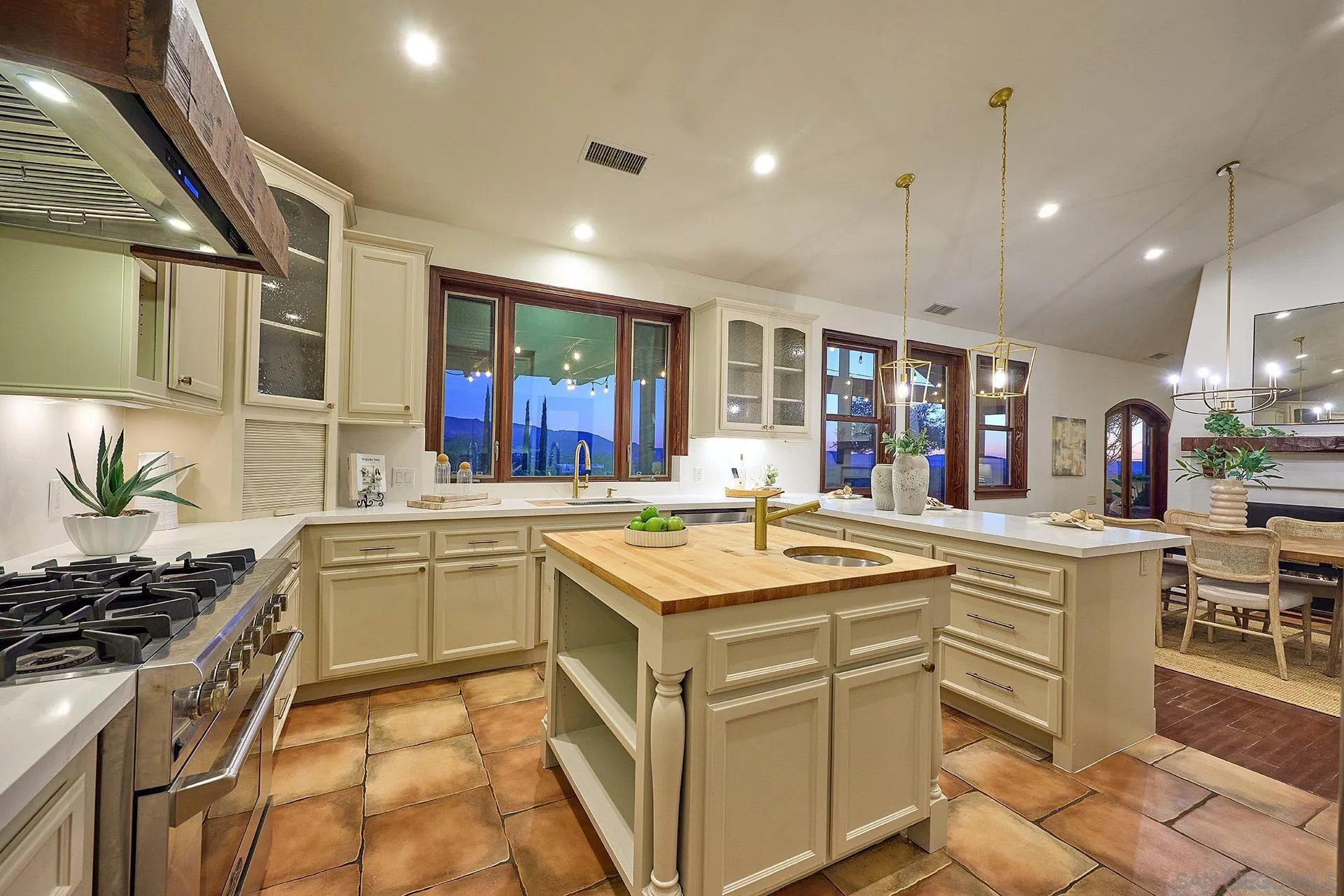 38408 Mesa Road Temecula, CA 92592 - Photo 10 of 57 a kitchen with a sink stove and cabinets