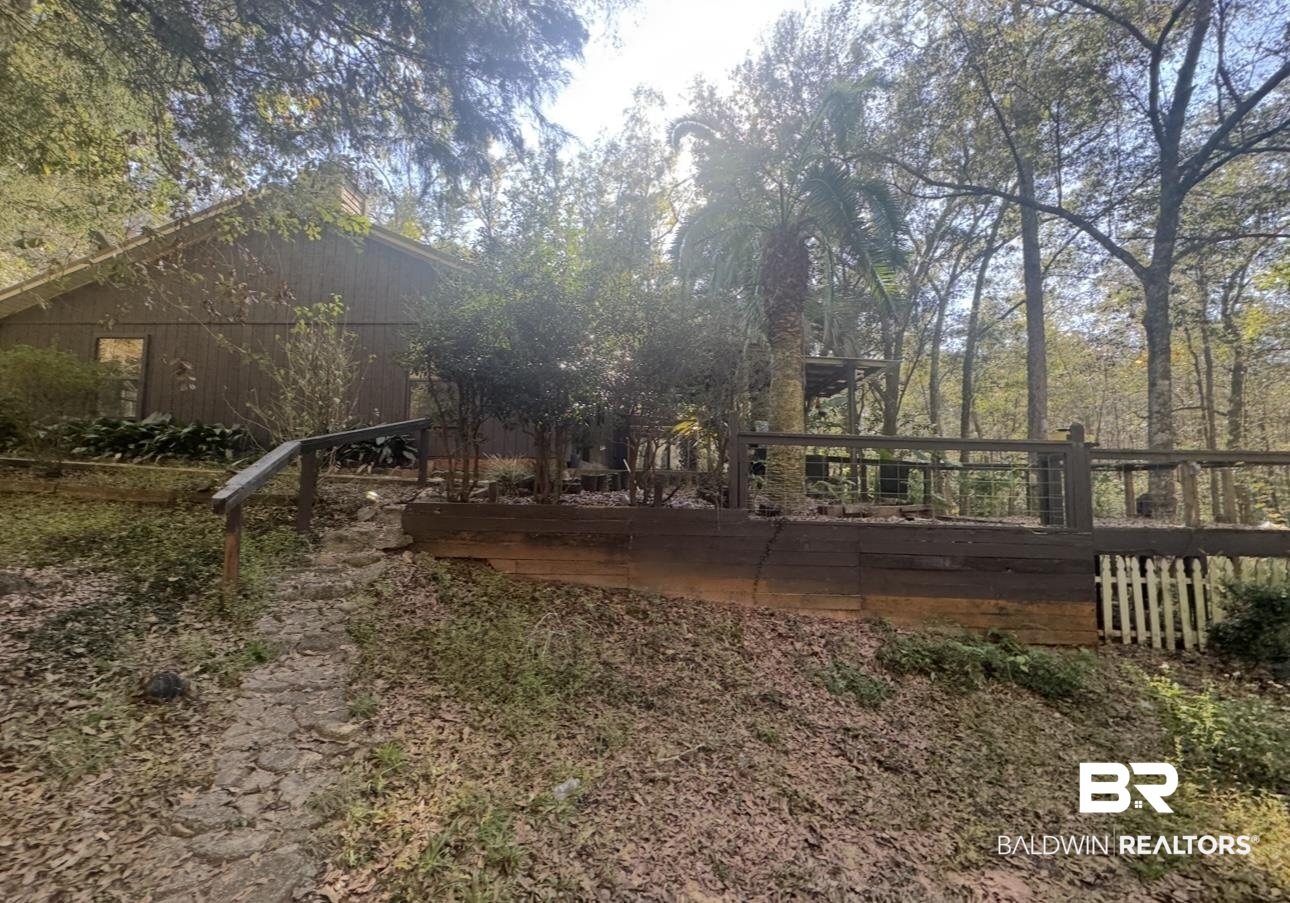 23341 County Road 49 Silverhill, AL 36576 - Photo 16 of 23 Rear view of house featuring a deck