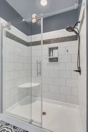 a bathroom with a shower and a sink