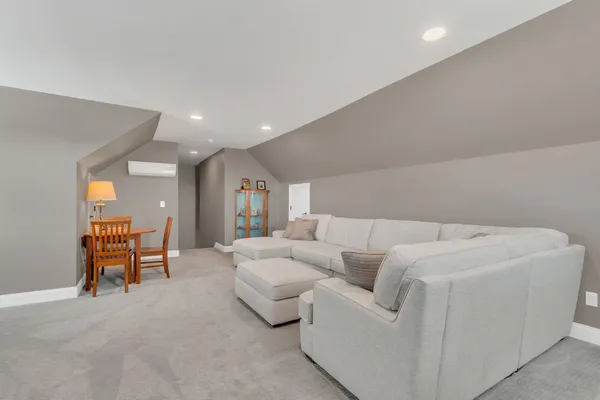 a living room with furniture and a table