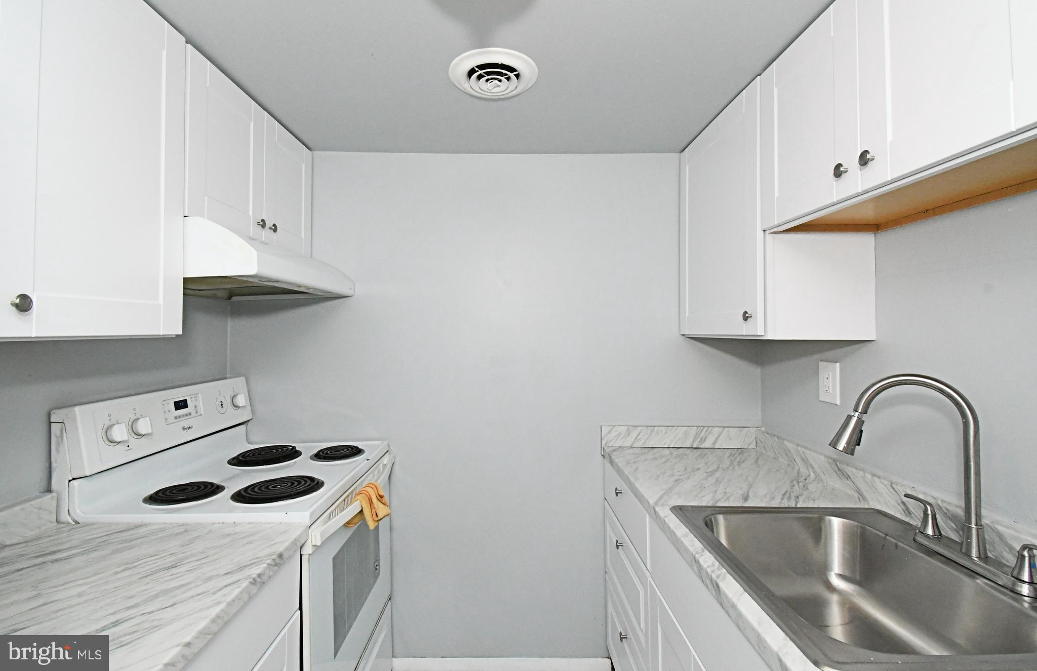 608 Easton Road Willow Grove, PA 19090 - Photo 7 of 10 a kitchen with a sink a stove and cabinets