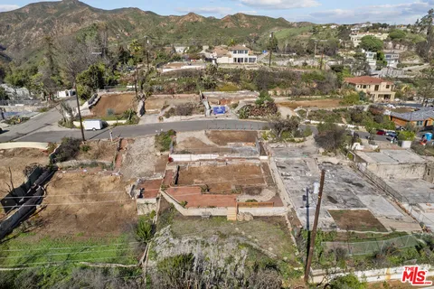 an aerial view of residential building with city view