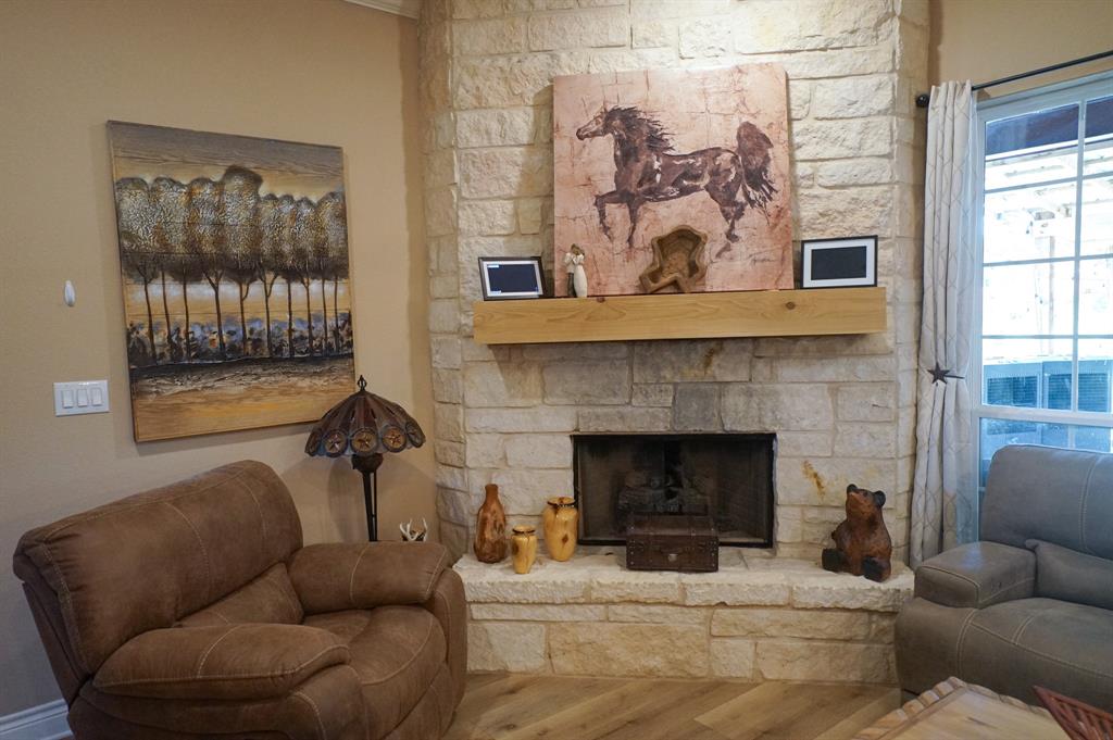 617 Mesquite Tree Road Waco, TX 76705 - Photo 12 of 39 a living room with furniture and a fireplace