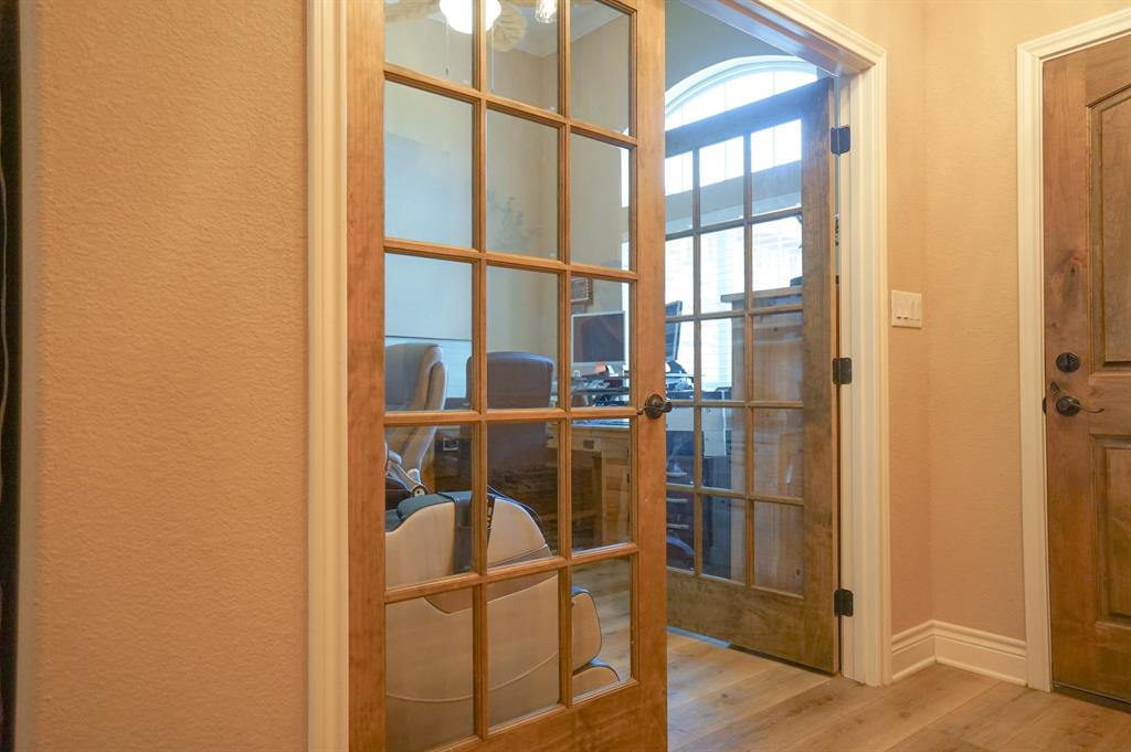 617 Mesquite Tree Road Waco, TX 76705 - Photo 17 of 39 a room with wooden floor and windows