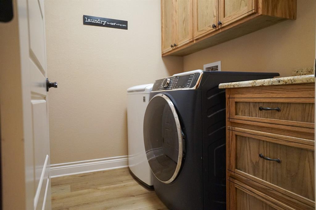 617 Mesquite Tree Road Waco, TX 76705 - Photo 19 of 39 a utility room with dryer and washer