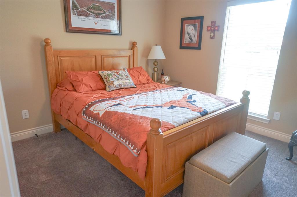 617 Mesquite Tree Road Waco, TX 76705 - Photo 26 of 39 a bed sitting in a bedroom next to a window