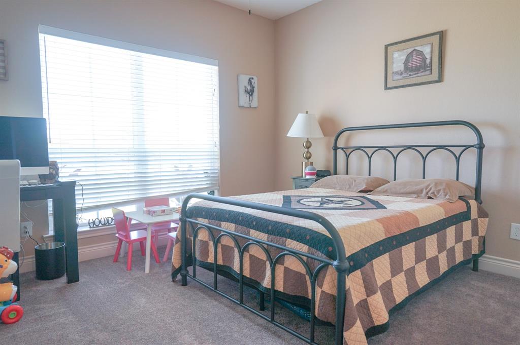 617 Mesquite Tree Road Waco, TX 76705 - Photo 27 of 39 a bedroom with a bed and a window