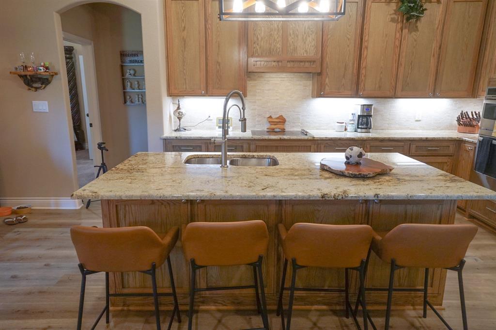 617 Mesquite Tree Road Waco, TX 76705 - Photo 4 of 39 a kitchen with a table chairs sink and cabinets