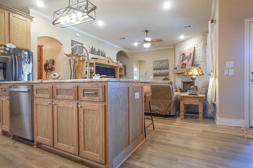 617 Mesquite Tree Road Waco, TX 76705 - Photo 5 of 39 a view of a dining room with furniture a chandelier and wooden floor
