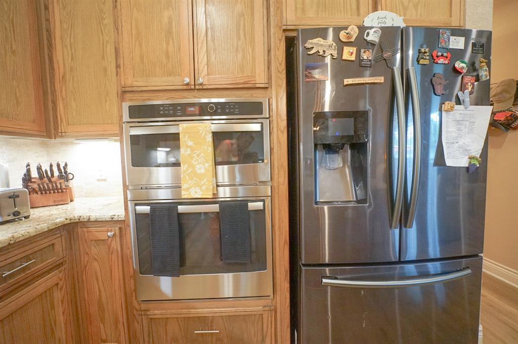 617 Mesquite Tree Road Waco, TX 76705 - Photo 8 of 39 a view of a refrigerator in kitchen and an empty room