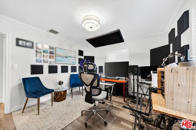 a living room with furniture a rug and a flat screen tv