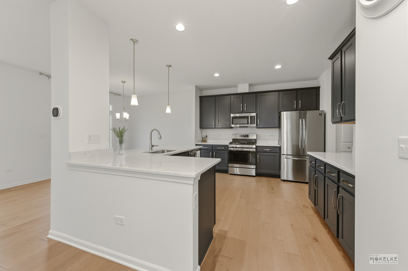 4184 Calder Lane Aurora, IL 60504 - Photo 14 of 35 a kitchen with kitchen island a sink stainless steel appliances and cabinets