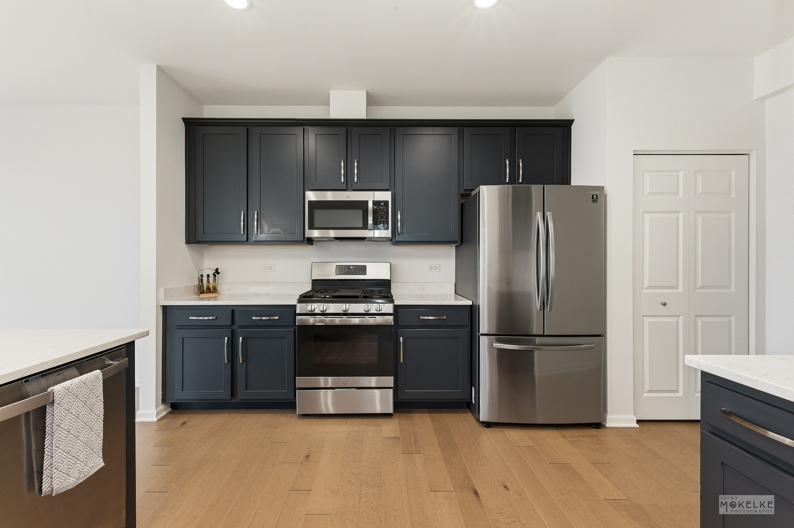 4184 Calder Lane Aurora, IL 60504 - Photo 15 of 35 a kitchen with granite countertop a refrigerator and a stove top oven