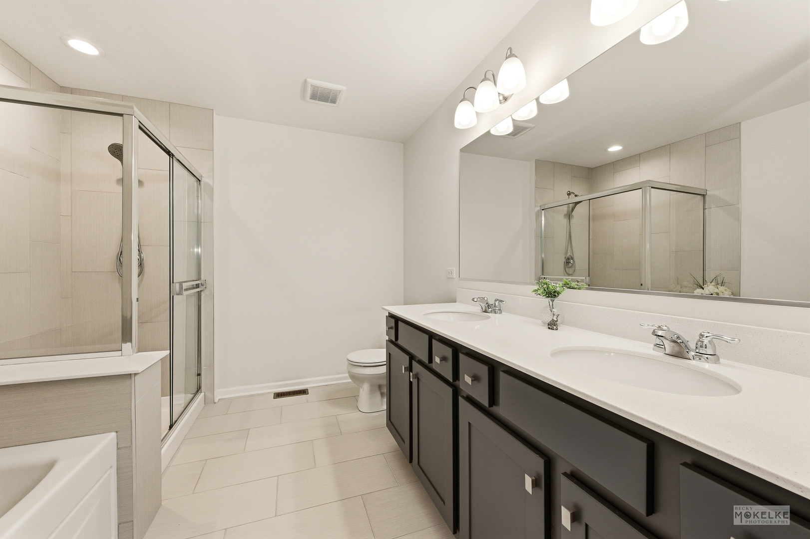4184 Calder Lane Aurora, IL 60504 - Photo 26 of 35 a bathroom with a double vanity sink mirror and shower