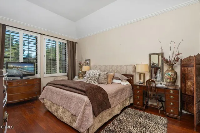 a en suite bathroom with a granite countertop sink and a mirror