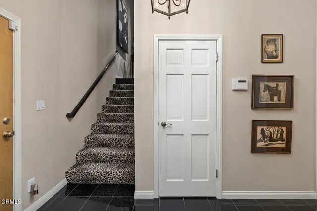 a view of a bench in backyard of a house