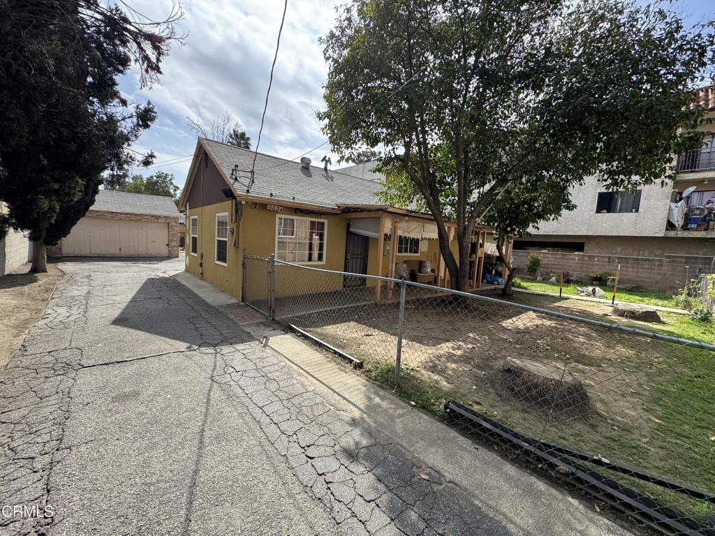 15624 Vanowen Street Van Nuys, CA 91406 - Photo 4 of 9 a view of a house with a yard
