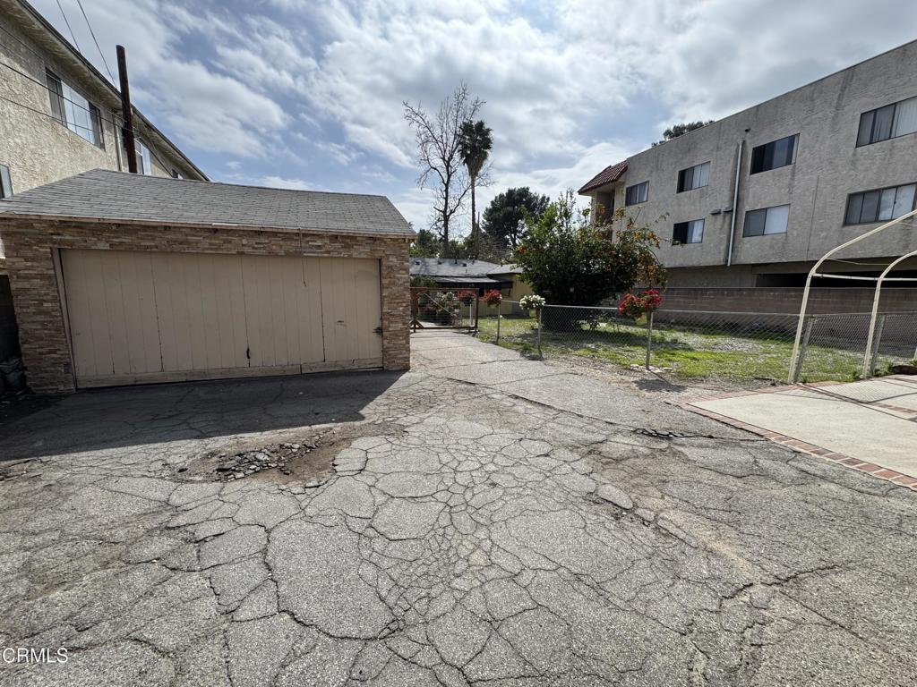 15624 Vanowen Street Van Nuys, CA 91406 - Photo 5 of 9 a view of a house with a yard