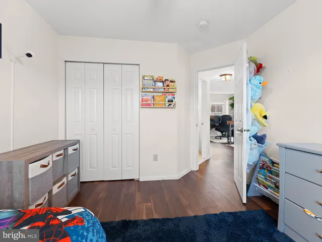a hallway with toys and wooden floor