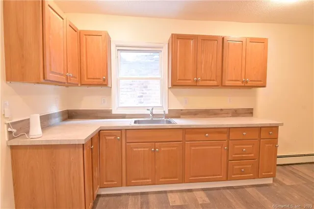 a kitchen with stainless steel appliances granite countertop a sink and a cabinets