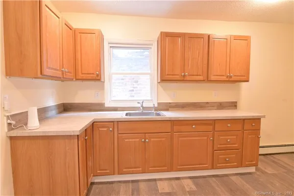 a kitchen with stainless steel appliances granite countertop a sink and a cabinets