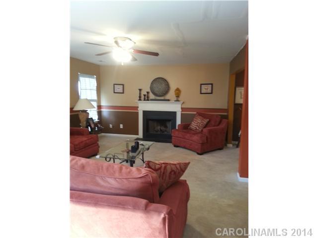 2742 Rustic Ridge Court, Unit 71 Rock Hill, SC 29730 - Photo 2 of 16 a living room with furniture and a fireplace