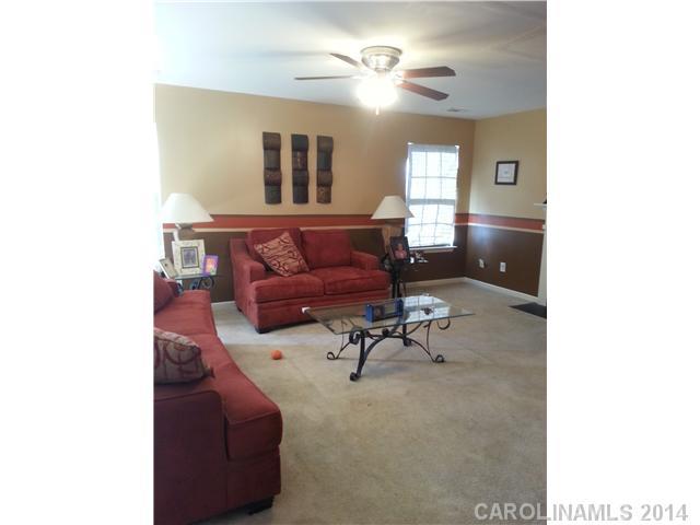 2742 Rustic Ridge Court, Unit 71 Rock Hill, SC 29730 - Photo 3 of 16 a living room with furniture and a chandelier