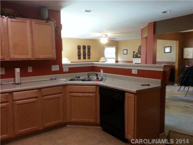 2742 Rustic Ridge Court, Unit 71 Rock Hill, SC 29730 - Photo 5 of 16 a kitchen with a sink and cabinets