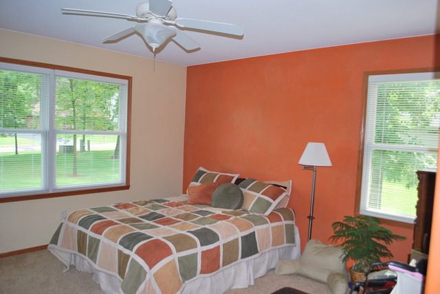 9217 Oak Ridge Drive Rochelle, IL 61068 - Photo 11 of 25 a bedroom with a bed lamp and a large window