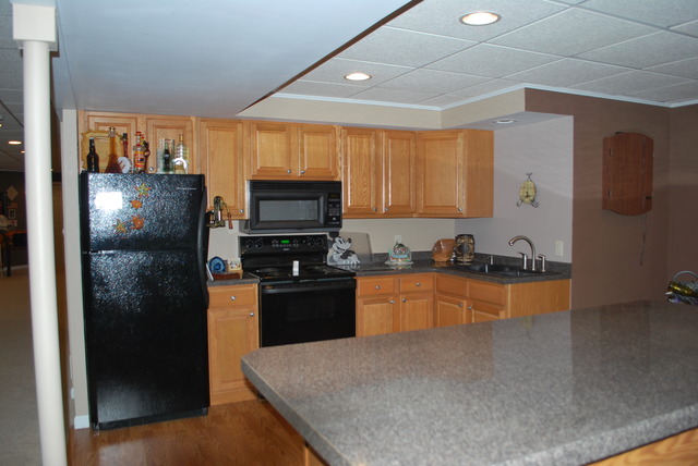 9217 Oak Ridge Drive Rochelle, IL 61068 - Photo 16 of 25 a kitchen with granite countertop a refrigerator stove and sink