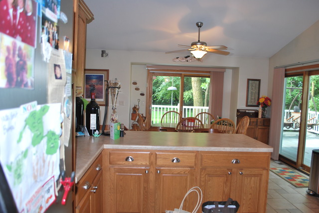 9217 Oak Ridge Drive Rochelle, IL 61068 - Photo 3 of 25 a view of a dining room with furniture a chandelier and window