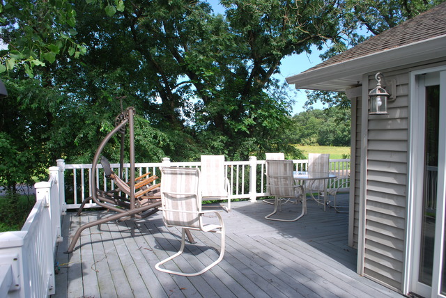 9217 Oak Ridge Drive Rochelle, IL 61068 - Photo 21 of 25 a view of balcony with wooden floor and outdoor seating