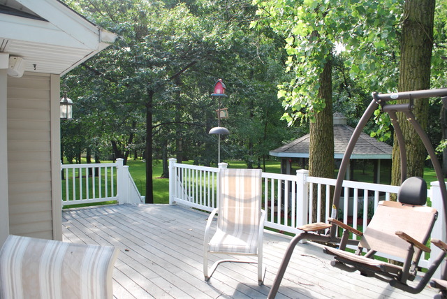 9217 Oak Ridge Drive Rochelle, IL 61068 - Photo 23 of 25 a view of a chair and tables under the house