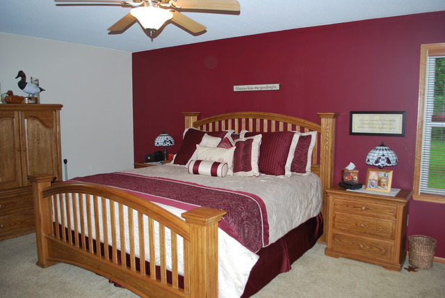 9217 Oak Ridge Drive Rochelle, IL 61068 - Photo 9 of 25 a bedroom with a bed and a chandelier