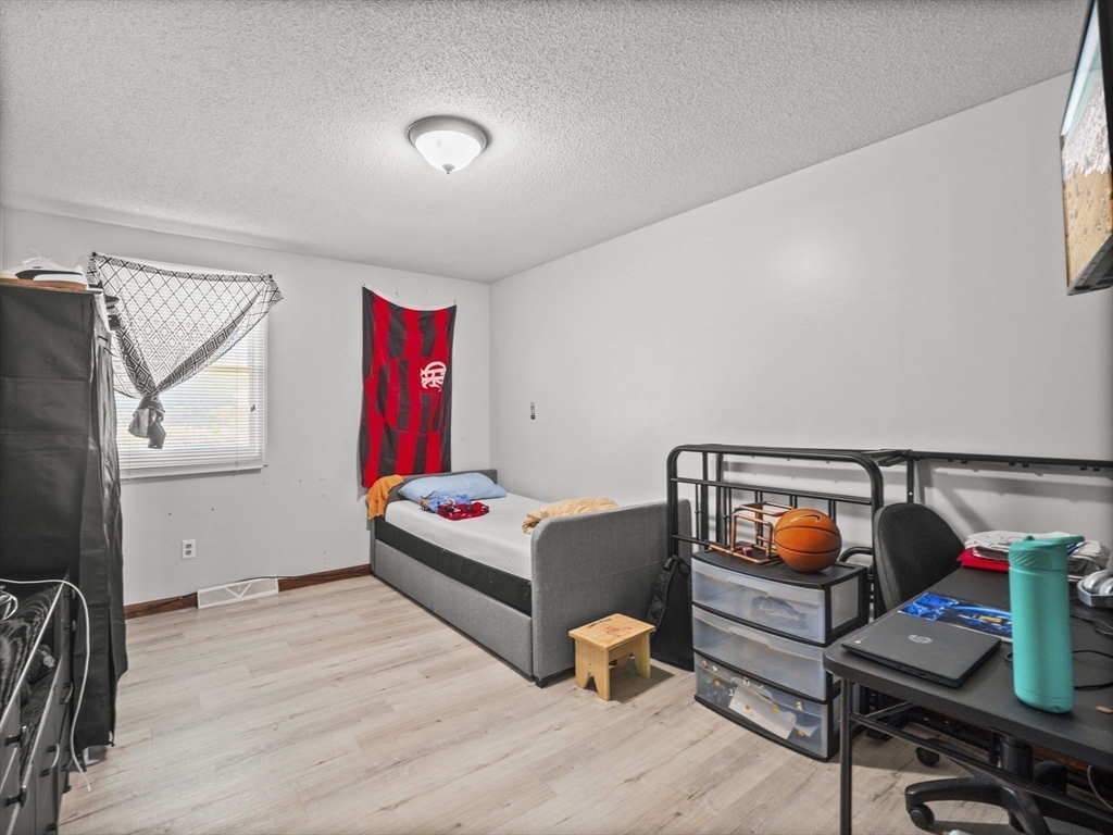 146 Lisbon Street Fall River, MA 02721 - Photo 15 of 42 a bedroom with furniture and a window