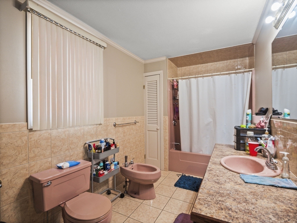 146 Lisbon Street Fall River, MA 02721 - Photo 16 of 42 a room with furniture and a wooden floor