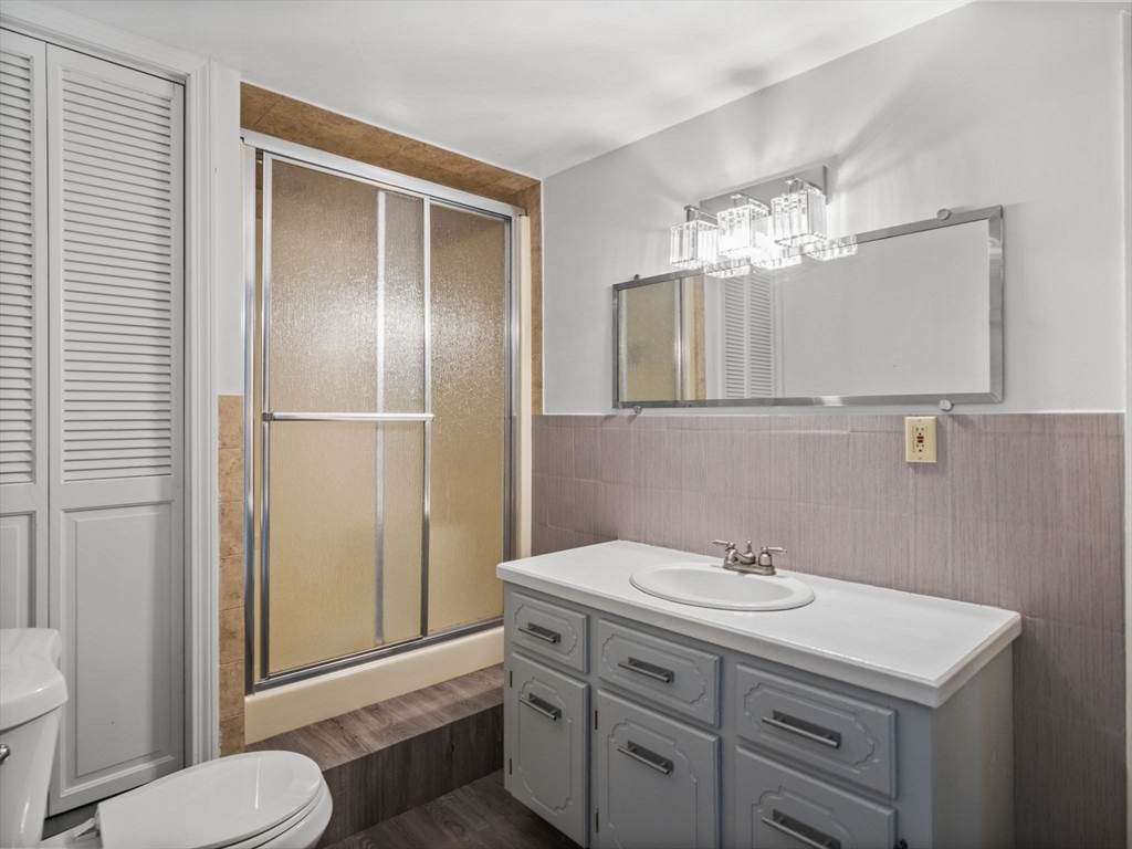 146 Lisbon Street Fall River, MA 02721 - Photo 21 of 42 a bathroom with a sink toilet and mirror