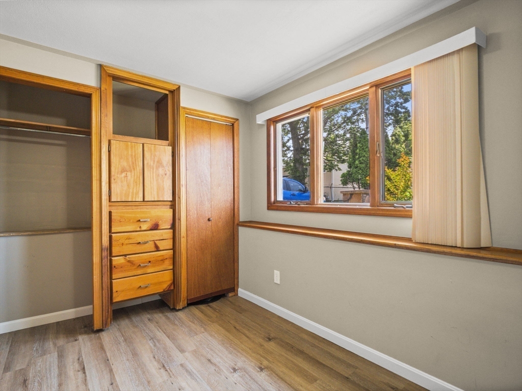 146 Lisbon Street Fall River, MA 02721 - Photo 23 of 42 an empty room with window and wooden floor