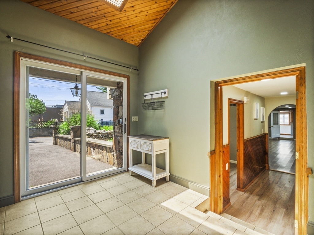146 Lisbon Street Fall River, MA 02721 - Photo 28 of 42 a view of a hallway with wooden floor and dining room