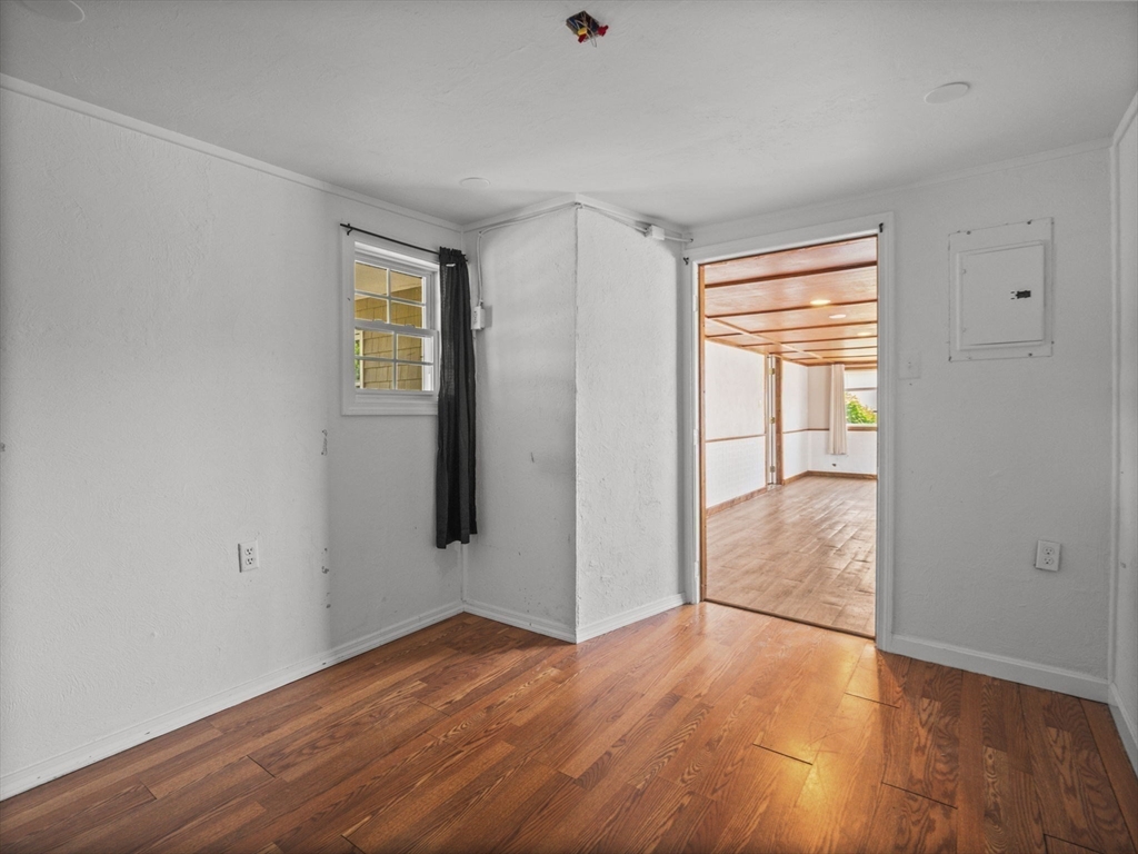 146 Lisbon Street Fall River, MA 02721 - Photo 29 of 42 a view of empty room with wooden floor and fan