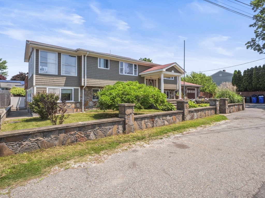 146 Lisbon Street Fall River, MA 02721 - Photo 3 of 42 a view of a house with a yard and plants